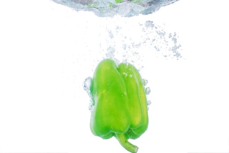 Pepper fruit into the water the momentの写真素材