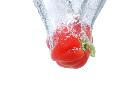 Pepper fruit into the water the momentの写真素材