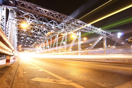 Traffic across the bridge at nightの写真素材