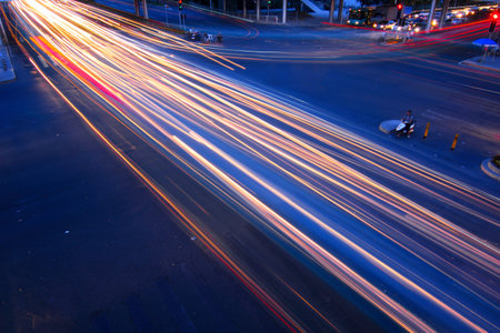 road with car traffic at night and blurry lights showing speed and motion