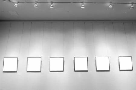 empty frames in a room against a white wallの写真素材