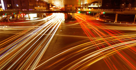 light trails on urban road in rush hour traffic at night