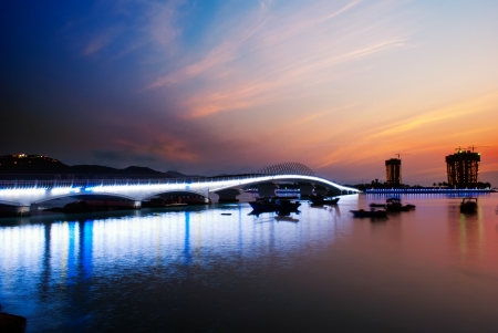 China Hainan,shanya sunset silhouette and boatsの写真素材