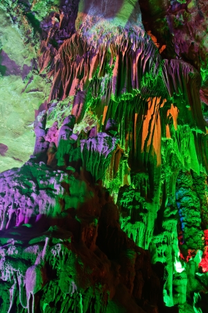 colorful limestone cave with perfect reflections in waterの写真素材