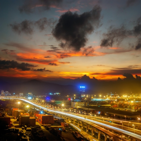 Freeway in night with cars light in modern cityの写真素材
