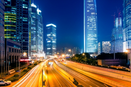 light trails on the street with modern building background in shanghai,Chinaの写真素材