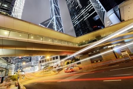 Car light trails and urban landscape in Hong Kongの写真素材