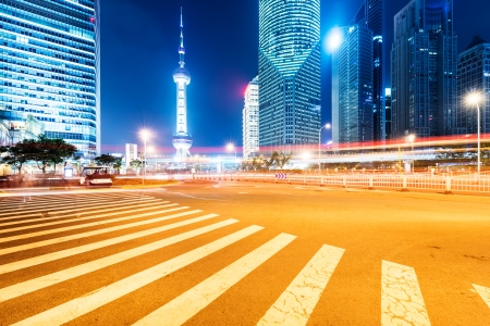 the light trails on the modern building background in shanghai chinaのeditorial素材