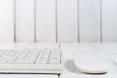 White computer mouse on the keyboardの写真素材