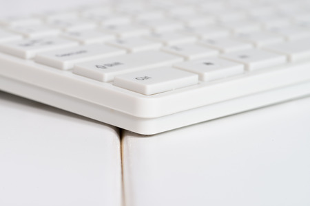 White computer mouse on the keyboardの写真素材