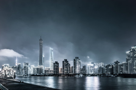 beautiful shanghai bund with curved light trails on the street in evening