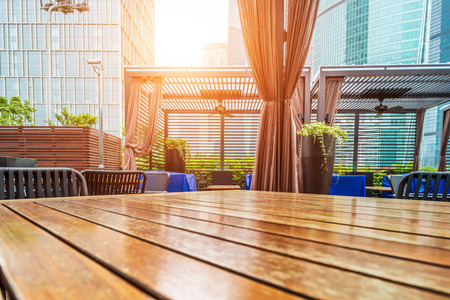 Wooden table in the outdoor coffee roomの写真素材