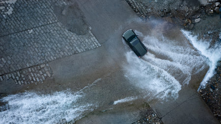 Car tire splashing in water