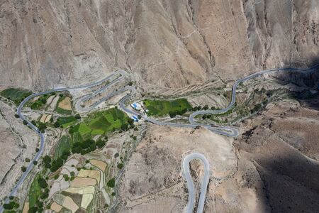 Winding road  aerial view, Tibet, Chinaの写真素材