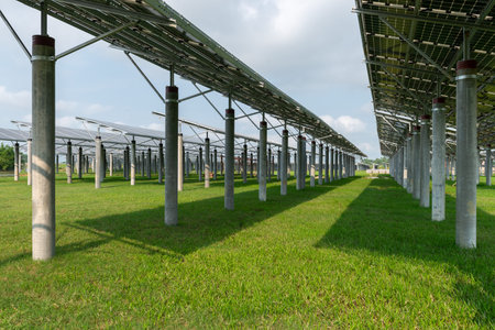 Solar panel on green grass isolated on white background