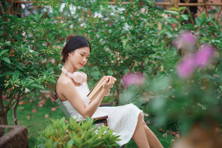 the girl is reading in the yardの写真素材