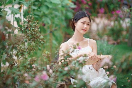 The girl is reading in the yardの写真素材