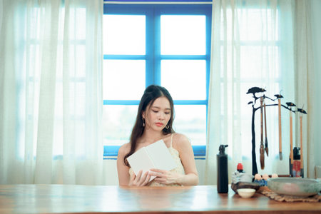 The girl reads in the studyの写真素材