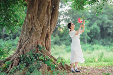 fashion girl is under a banyan treeの写真素材
