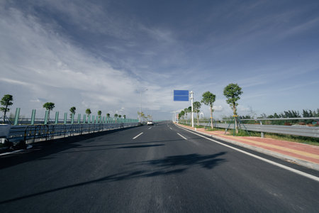 steel bridge and road with sunset sky