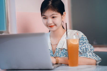 Beautiful young girls are using laptopsの写真素材