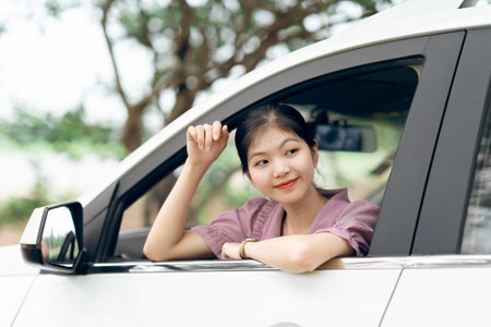 Female driver beginner sitting in a carの写真素材