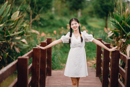 College girl in the gardenの写真素材