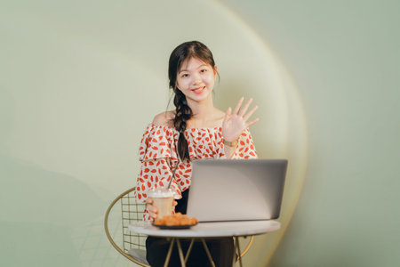 Beautiful Asian girl working at homeの写真素材