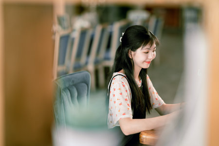 The girl reads in the coffee shopの写真素材