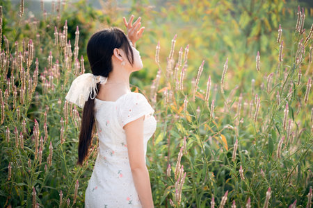 Asian girls among the flowersの写真素材