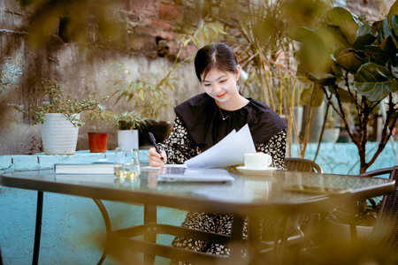 Asian girls work at homeの写真素材