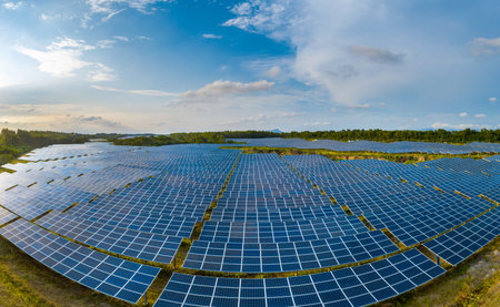 aerial view of solar power panels in clean energy generating stationの写真素材
