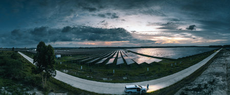 aerial view of solar power panels in clean energy generating stationの写真素材
