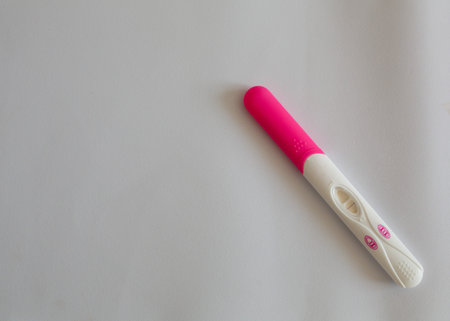 Positive pregnancy test on white background with copy space for text.の写真素材