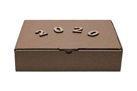2020 numerals of the new year on the Cardboard brown closed rectangular box isolated on white...