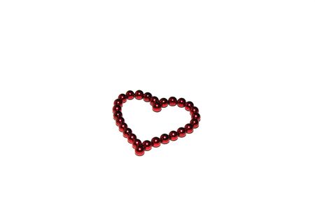 Red heart made of red magnetic beads is isolated on white background. Concept of love and Valentine's day. Greeting card. Copy space.の写真素材