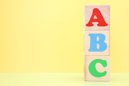 ABC -the first letters of the English alphabet on wooden toy cubes. Learn foreign languages. English...