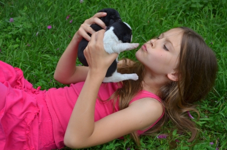 Portrait of a girl with puppyの写真素材