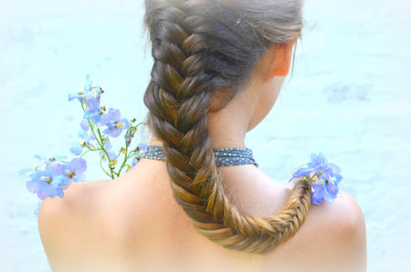 Girl with long braided hair - hairstyle fishtail