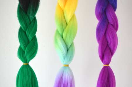 Kanekalon. Colored artificial strands of hair. Material for plaiting braids.の写真素材