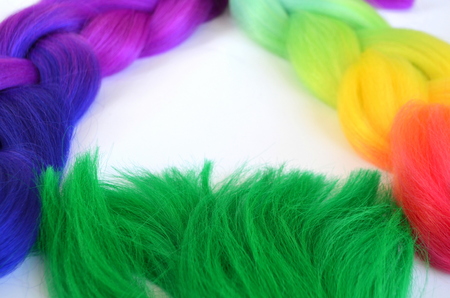 Kanekalon. Colored artificial strands of hair. Material for plaiting braidsの写真素材