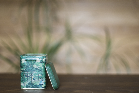 Green jar for plant on wooden table with blur backgroundの写真素材