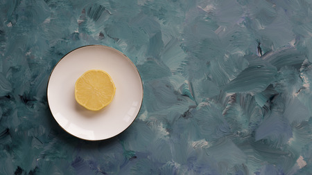 Lemon slice on white plateの写真素材