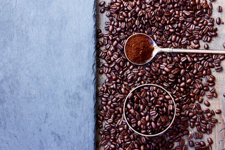 Top view of Coffee beans on grunge dark backgroundの写真素材