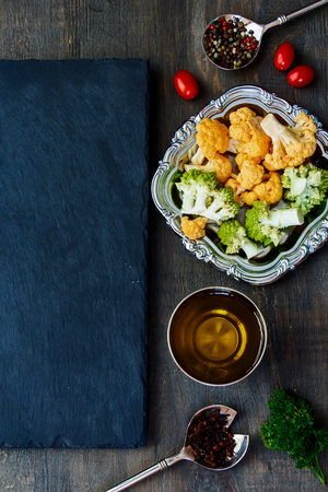 Fresh cauliflower and Healthy Organic Vegetables on a Wooden Background. Top viewの写真素材