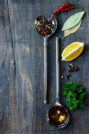 Herbs and spices over wooden background. Top view.の写真素材