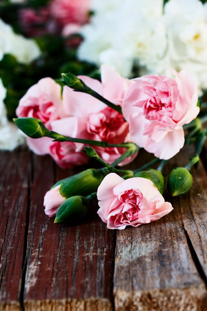 Bouquet of colorful flowers on rustic wooden background. Selective focus.の写真素材