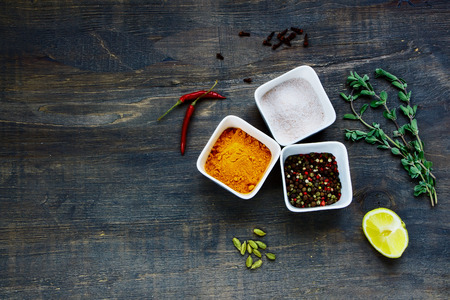 Top view of spices and herbs selection on rustic wooden backgroundの写真素材