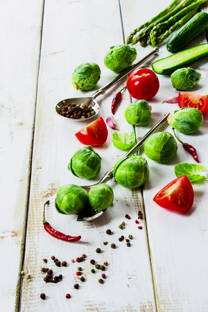 Healthy Organic Vegetables and spices on White Wooden Backgroundの写真素材