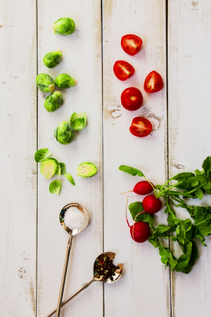 Fresh vegetables and spices on white wooden background. Top view.の写真素材